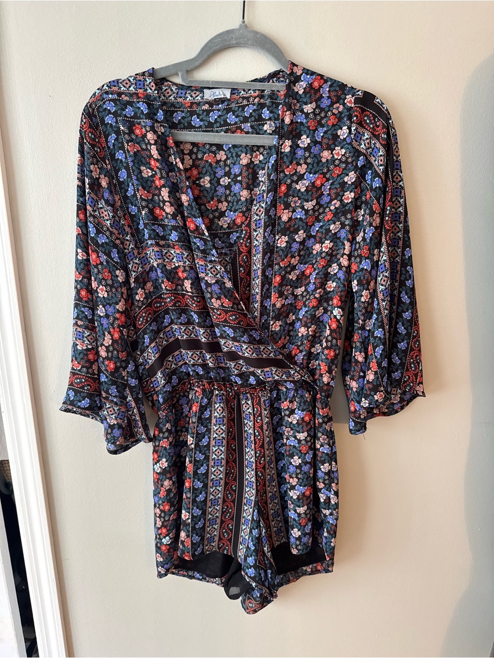 Abbeline Black Floral Romper with Red and Blue Accents